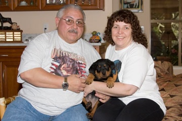 Dark Blue Boy with new family